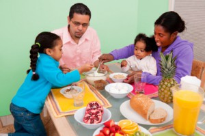 Latino/Hispanic/African-American family eating breakfast